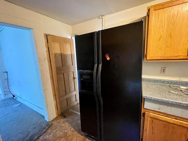 kitchen featuring black fridge