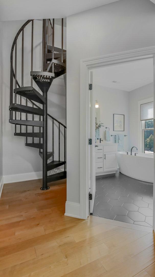 stairs featuring hardwood / wood-style flooring