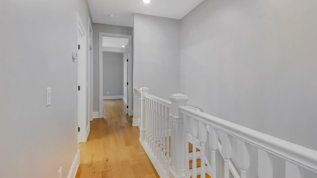 corridor with light hardwood / wood-style flooring