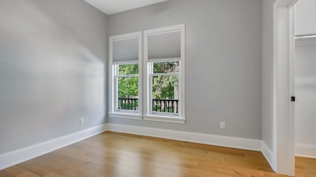 empty room with light hardwood / wood-style floors