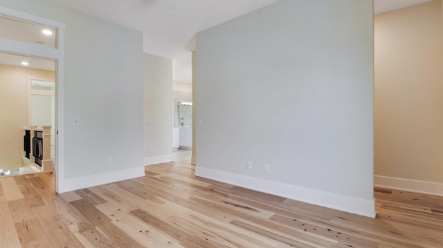 spare room featuring light wood-type flooring