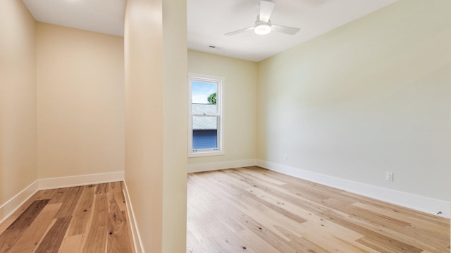 spare room featuring light wood-type flooring and ceiling fan