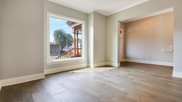 empty room with light hardwood / wood-style flooring and ornamental molding