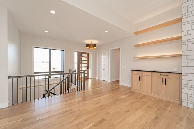 interior space featuring light wood-style flooring, recessed lighting, and baseboards