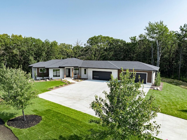 ranch-style house with a garage and a front yard