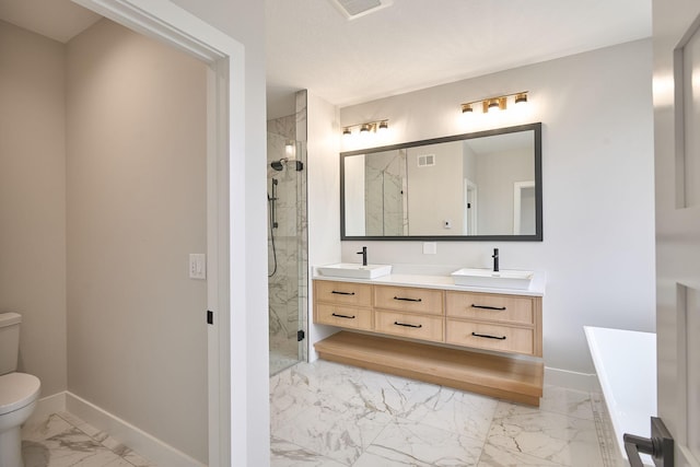 bathroom with a sink, a marble finish shower, toilet, and marble finish floor