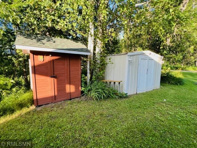 view of outdoor structure with a lawn