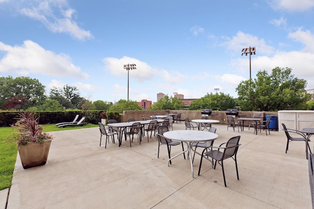 view of patio with fence and outdoor dining area