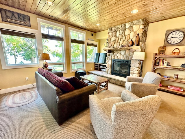 living room featuring light carpet, a fireplace, and wooden ceiling