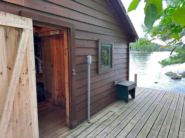 exterior space featuring a water view and a boat dock