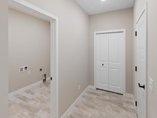 laundry area with baseboards, laundry area, hookup for a washing machine, and hookup for an electric dryer