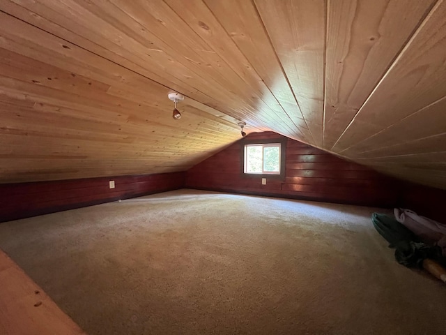 additional living space featuring wooden ceiling, carpet, and vaulted ceiling