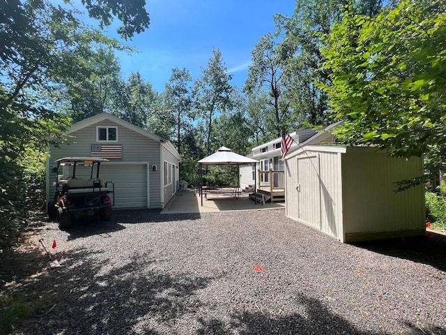 view of yard featuring a deck and an outdoor structure