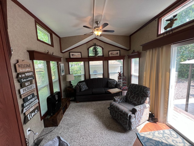 living room with ceiling fan, ornamental molding, and high vaulted ceiling