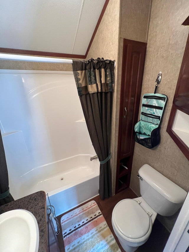 full bathroom with sink, shower / bath combo, and toilet