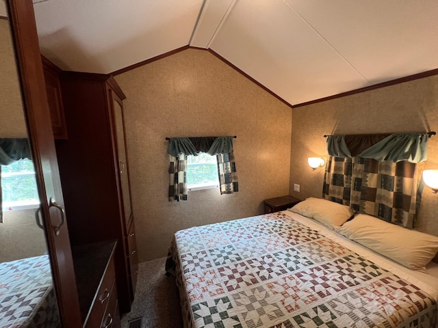 carpeted bedroom featuring vaulted ceiling