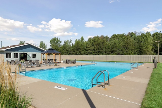 view of swimming pool featuring a patio area and a gazebo