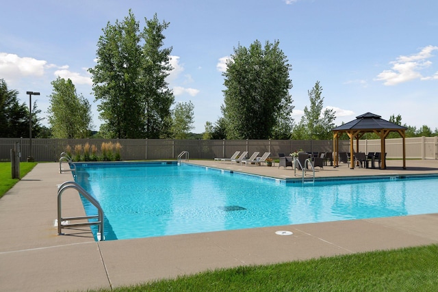 view of swimming pool featuring a gazebo and a patio