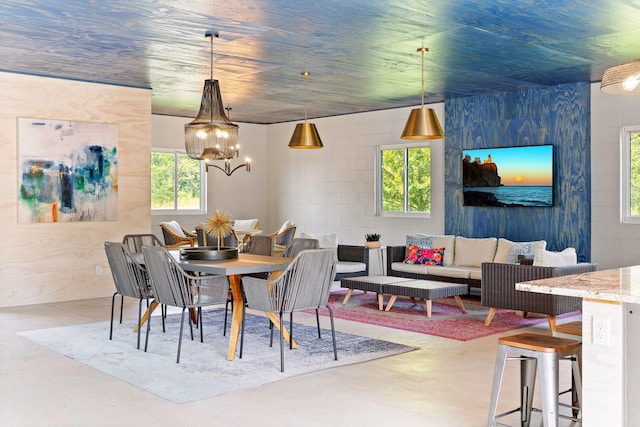 dining area featuring an inviting chandelier