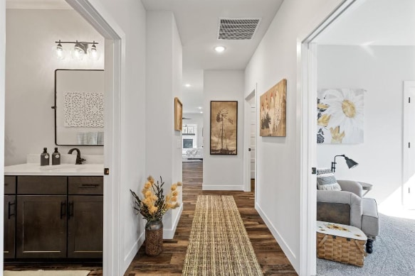 corridor with dark hardwood / wood-style floors and sink