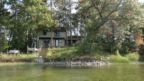 back of house with a water view