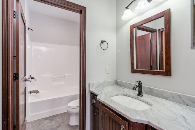 full bathroom featuring tile flooring, washtub / shower combination, vanity, and toilet