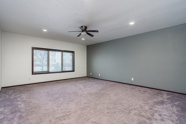 empty room with carpet flooring and ceiling fan