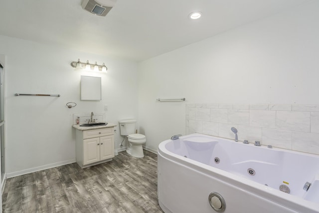 bathroom featuring vanity, toilet, and hardwood / wood-style floors