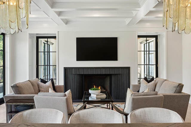 living room featuring coffered ceiling and beam ceiling