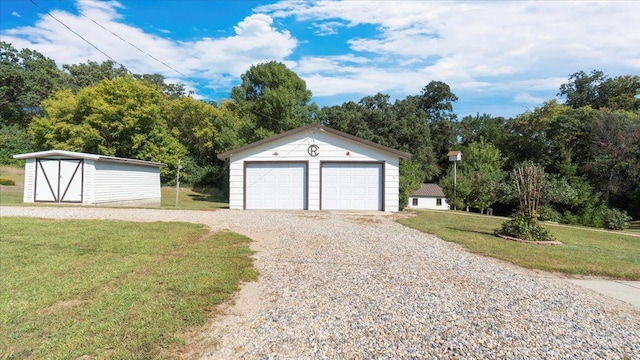 garage featuring a lawn