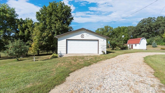 garage with a lawn