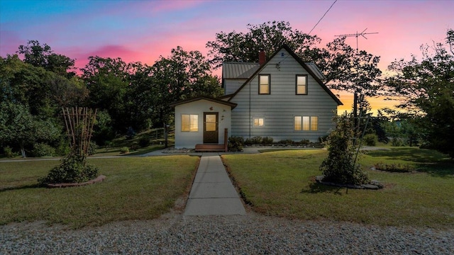 view of front of house with a yard