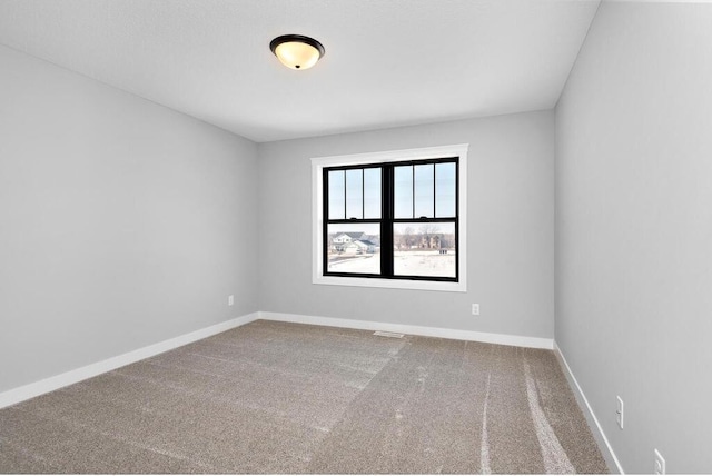 empty room featuring carpet flooring