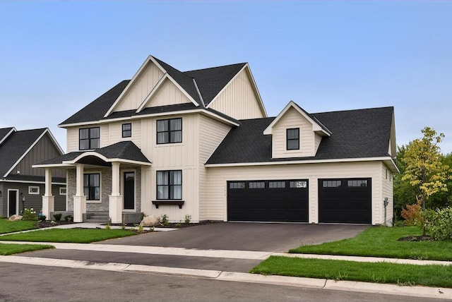 modern inspired farmhouse with a garage