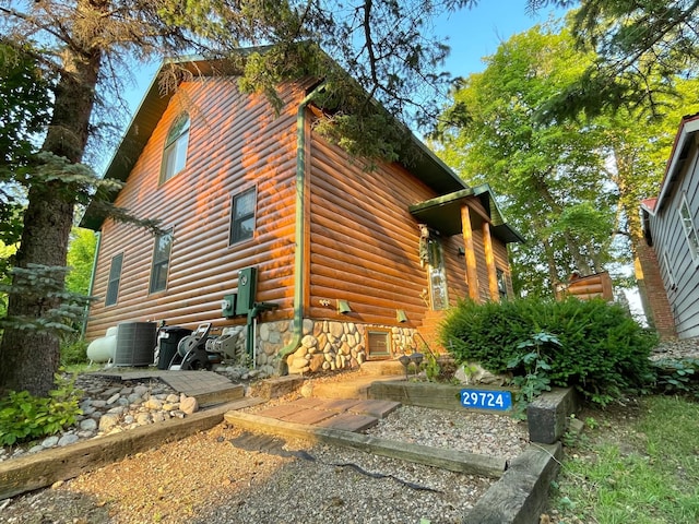 29724 387th St, Waubun, MN 56589 - view of side of property featuring central AC unit and stone siding