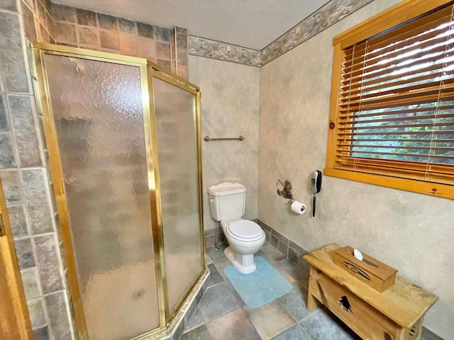 29724 387th St, Waubun, MN 56589 - bathroom featuring a stall shower, a textured ceiling, and toilet