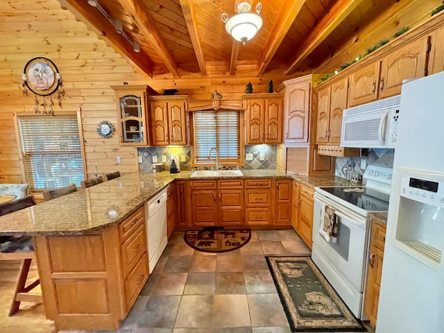 29724 387th St, Waubun, MN 56589 - kitchen featuring white appliances, a sink, a peninsula, tasteful backsplash, and wood walls