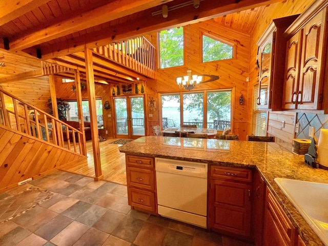 29724 387th St, Waubun, MN 56589 - kitchen with dishwasher, wood walls, a sink, a peninsula, and a chandelier