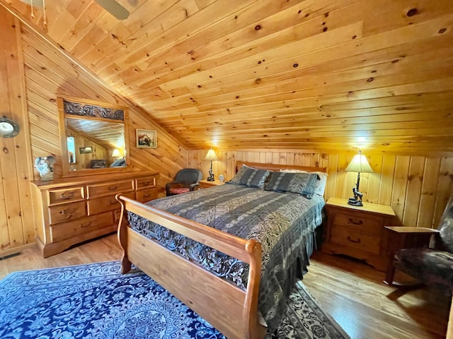 29724 387th St, Waubun, MN 56589 - bedroom with vaulted ceiling, wooden walls, hardwood / wood-style floors, and wood ceiling