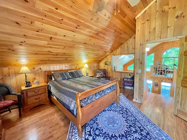 29724 387th St, Waubun, MN 56589 - bedroom with vaulted ceiling, wooden walls, wood finished floors, and wood ceiling