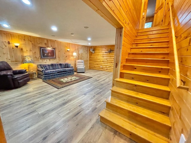 29724 387th St, Waubun, MN 56589 - living room with stairs, light wood-style flooring, recessed lighting, and wooden walls