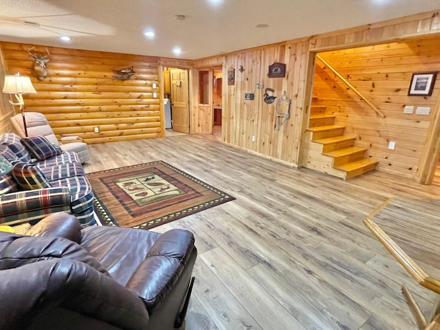 29724 387th St, Waubun, MN 56589 - living room with wood finished floors, stairway, log walls, and recessed lighting