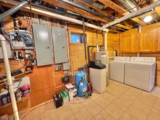29724 387th St, Waubun, MN 56589 - unfinished basement featuring electric panel, washing machine and dryer, light tile patterned floors, wooden walls, and electric water heater