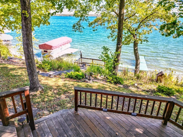 29724 387th St, Waubun, MN 56589 - wooden deck with a water view, a boat dock, and boat lift