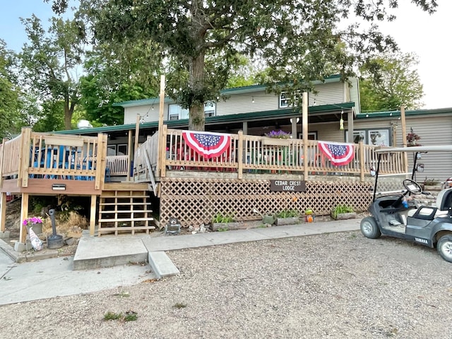29724 387th St, Waubun, MN 56589 - rear view of property with stairway and a wooden deck