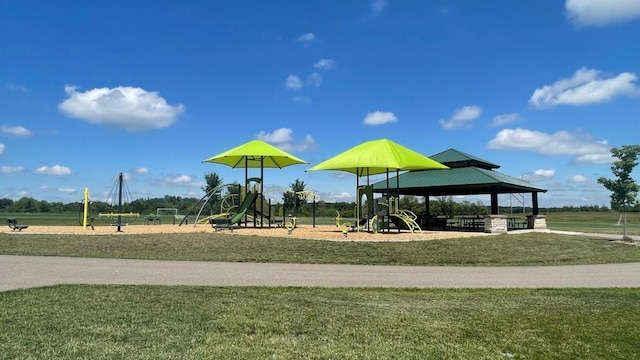 exterior space with a playground, a gazebo, and a yard