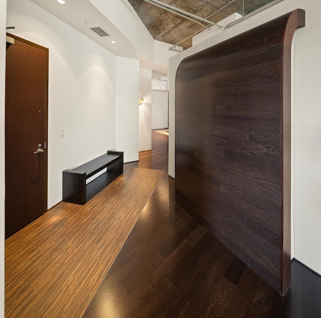 hallway with dark hardwood / wood-style floors