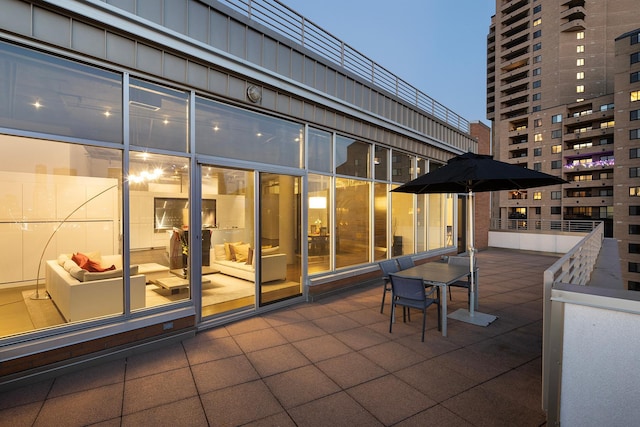 view of patio terrace at dusk