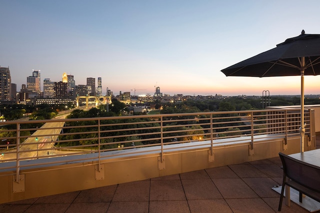 patio terrace at dusk with a balcony