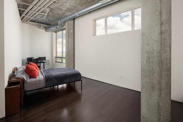 bedroom featuring dark hardwood / wood-style flooring